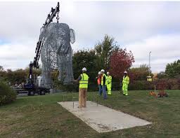 Using a crane to place the wire elephant